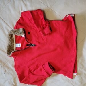Thicker red pullover. Never been worn.